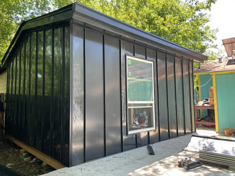 Black standing seam metal wall panels for Roof Inspection in Walnut