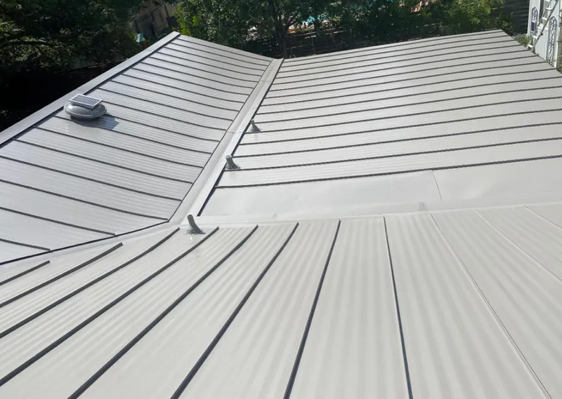 Solar attic fan installed on a metal roof for Roof Ventilation in Walnut